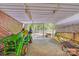Organized shed with a tractor, lawn mower, and gardening tools, catering to outdoor needs at 211 Drive Inn Rd, Locust, NC 28097