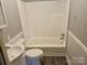 Standard bathroom with a sink, toilet, and tub/shower combo at 211 Putnam St, Shelby, NC 28152