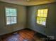 Bedroom featuring wood floors, two windows, and potential for customization at 211 Putnam St, Shelby, NC 28152