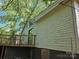 Exterior view featuring the back of the house, including a deck and peeling paint at 211 Putnam St, Shelby, NC 28152