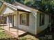 Exterior view of house with peeling paint and brown shutters at 211 Putnam St, Shelby, NC 28152