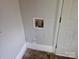 Laundry hookup featuring electric outlets and water supply fixtures at 211 Putnam St, Shelby, NC 28152