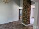 Living room with a brick column and flooring transition at 211 Putnam St, Shelby, NC 28152