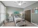 The bedroom offers soothing colors, a ceiling fan, and two bedside tables for storage at 224 Wendover Heights Cir, Charlotte, NC 28211
