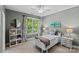 Bright bedroom with a ceiling fan, a large window, and ample natural light, perfect for relaxation at 224 Wendover Heights Cir, Charlotte, NC 28211