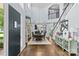 Elegant dining area with a chandelier, hardwood floors, and seamless access to the adjacent living area at 224 Wendover Heights Cir, Charlotte, NC 28211