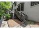 Exterior view of the house showcasing the elevated deck and steps leading to the yard at 224 Wendover Heights Cir, Charlotte, NC 28211