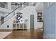 Grand foyer with hardwood floors, a staircase, and stylish decor creating a welcoming atmosphere at 224 Wendover Heights Cir, Charlotte, NC 28211
