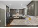 Contemporary kitchen boasts granite countertops, stainless steel appliances, and sleek gray cabinets at 224 Wendover Heights Cir, Charlotte, NC 28211