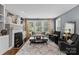 Cozy living room featuring a fireplace, built-in shelves, and comfortable seating at 224 Wendover Heights Cir, Charlotte, NC 28211