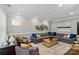 Comfortable living room with sectional sofa, area rug, and decorative wall art at 224 Wendover Heights Cir, Charlotte, NC 28211