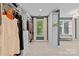 Walk-in closet featuring custom shelving, drawers and clothing racks for maximum clothing storage at 224 Wendover Heights Cir, Charlotte, NC 28211