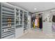 Custom walk-in closet with ample shelving, drawers, and clothing racks, offering organized storage at 224 Wendover Heights Cir, Charlotte, NC 28211