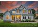 Beautiful two-story home with a welcoming porch and manicured landscaping at 2593 Las Brisas Ln, Denver, NC 28037