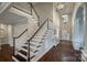 Spacious foyer with a staircase, stylish lighting, and decorative hardwood floors at 2593 Las Brisas Ln, Denver, NC 28037