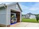 Spacious garage housing a RV, with the main house visible in the background at 2593 Las Brisas Ln, Denver, NC 28037