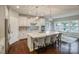 Bright kitchen features a large island, pendant lighting, and stainless steel appliances at 2593 Las Brisas Ln, Denver, NC 28037