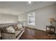 Comfortable living room with dark wood flooring, featuring a step-down sitting area and neutral wall paint at 2593 Las Brisas Ln, Denver, NC 28037