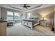 Tranquil main bedroom with tray ceiling, lake view, and neutral decor at 2593 Las Brisas Ln, Denver, NC 28037