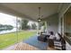 Relaxing screened porch with comfortable seating and scenic lake views at 2593 Las Brisas Ln, Denver, NC 28037