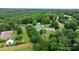 Aerial view of the property nestled in a wooded area with mature trees and greenery at 2843 Hopewell Church Rd, Sherrills Ford, NC 28673