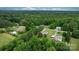 Aerial view of multiple homes nestled in a densely wooded landscape at 2843 Hopewell Church Rd, Sherrills Ford, NC 28673
