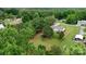 Scenic aerial view showcasing the property's ample lot surrounded by lush greenery at 2843 Hopewell Church Rd, Sherrills Ford, NC 28673
