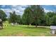 Expansive backyard featuring a shed, trampoline and tree coverage at 2843 Hopewell Church Rd, Sherrills Ford, NC 28673