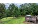 A spacious backyard featuring lush greenery, mature trees, and deck at 2843 Hopewell Church Rd, Sherrills Ford, NC 28673