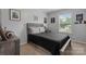 Cozy bedroom with comfortable bed, carpeted floor, and natural light at 2843 Hopewell Church Rd, Sherrills Ford, NC 28673