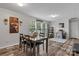 Spacious dining area with wood-look floors, leading to office and large window for natural light at 2843 Hopewell Church Rd, Sherrills Ford, NC 28673
