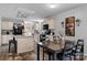 Kitchen view including the dining area, black appliances and ample counter space at 2843 Hopewell Church Rd, Sherrills Ford, NC 28673