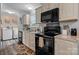 Modern kitchen featuring stainless steel appliances and light wood cabinets with updated countertops at 2843 Hopewell Church Rd, Sherrills Ford, NC 28673