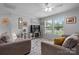 Comfortable living room featuring plush seating, a modern TV stand with fireplace, and bright windows for natural light at 2843 Hopewell Church Rd, Sherrills Ford, NC 28673