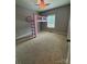 Bedroom showcasing a unique loft bed and neutral-toned walls at 28835 Hartsell Rd, Albemarle, NC 28001