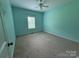 Cozy bedroom featuring carpet, a ceiling fan, and a window at 28835 Hartsell Rd, Albemarle, NC 28001