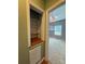 Hallway linen closet with wooden shelves at 28835 Hartsell Rd, Albemarle, NC 28001