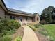 Charming brick home features a landscaped front yard and welcoming front porch at 28835 Hartsell Rd, Albemarle, NC 28001