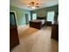 Spacious main bedroom with carpet floors, ceiling fan, and bedside tables and dressers at 28835 Hartsell Rd, Albemarle, NC 28001