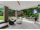 Covered back porch with comfortable seating and an outdoor kitchen at 2941 Forest Park Dr, Charlotte, NC 28209