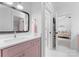 Bathroom with pink vanity and hexagon tile floor at 2941 Forest Park Dr, Charlotte, NC 28209