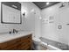 Beautiful bathroom with glass shower, subway tile walls, and antique vanity at 2941 Forest Park Dr, Charlotte, NC 28209