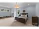 Bedroom with a large bed, window seating, and built in shelves at 2941 Forest Park Dr, Charlotte, NC 28209