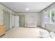 Bright Bedroom featuring floral wallpaper, trim paint and a white crib near a window for natural light at 2941 Forest Park Dr, Charlotte, NC 28209