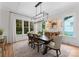Elegant dining room featuring a wooden table, stylish chairs, and large windows at 2941 Forest Park Dr, Charlotte, NC 28209