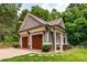 Two-car detached garage with carriage doors and well maintained landscaping at 2941 Forest Park Dr, Charlotte, NC 28209