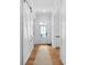 Hallway with white shiplap walls and hardwood floors at 2941 Forest Park Dr, Charlotte, NC 28209