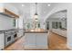 Spacious open kitchen with large center island and hardwood floors at 2941 Forest Park Dr, Charlotte, NC 28209