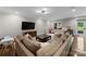Spacious living room with a large sectional sofa and ample natural light at 2941 Forest Park Dr, Charlotte, NC 28209