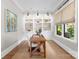 Bright office space with custom bookshelves, a wooden desk, and natural light at 2941 Forest Park Dr, Charlotte, NC 28209